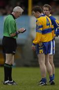 12 March 2005; Kevin Dilleen, Clare, is booked by referee Padraig Seoige. Allianz National Football League, Division 2A, Clare v Longford, Cusack Park, Ennis, Co. Clare. Picture credit; Ray McManus / SPORTSFILE