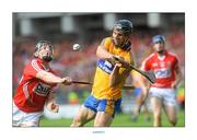 8 September 2013; Domhnall O'Donovan, Clare, shoots to score the equalising point despite the attentions of Stephen White, Cork. GAA Hurling All-Ireland Senior Championship Final, Cork v Clare, Croke Park, Dublin. Picture credit: Brian Lawless / SPORTSFILE