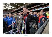 8 September 2013; Ard Comhairle stewart Colm Smith removes the Liam MacCarthy Cup to safe keeping after the game ended in a draw. GAA Hurling All-Ireland Senior Championship Final, Cork v Clare, Croke Park, Dublin. Picture credit: Ray McManus / SPORTSFILE