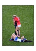 29 September 2013; Juliet Murphy, Cork, is congratulated by the team masseuse Eleanor Lucey as Monaghan's Cathriona McConnell lies dejected on the ground. TG4 All-Ireland Ladies Football Senior Championship Final, Cork v Monaghan, Croke Park, Dublin. Picture credit: Ray McManus / SPORTSFILE