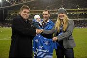 14 December 2013; Leinster Chief Executive Michael Dawson, left, makes a presentation to Paddy Lane, from Rathgar, Co. Dublin, but now living in Austin, Texas, USA, and his wife Whitney and son Stephen, who won the Bring A Fan Home competition. Heineken Cup 2013/14, Pool 1, Round 4, Leinster v Northampton Saints. Aviva Stadium, Lansdowne Road, Dublin. Picture credit: Brendan Moran / SPORTSFILE