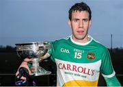 15 December 2013; Offaly captain Niall McNamee with the Fitzsimons Cup. Fitzsimons Cup Final, Meath v Offaly, Grangegodden, Kells, Co. Meath. Picture credit: Ramsey Cardy / SPORTSFILE