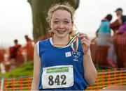 15 December 2013; Caoimhe Harrington, from West Muskerry Athletic Club, Co. Cork, celebrates with her medal after winning the Girls under-15 3500m at the Woodie’s DIY National Novice & Even Age Cross Country Championships. WIT Sports Campus, Carriganore, Co. Waterford. Picture credit: Matt Browne / SPORTSFILE