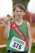 15 December 2013; Malcolm MacEvilly, from Westport Athletic Club, Co. Mayo, celebrates with his medal after winning the Boys under-11 1500m at the Woodie’s DIY National Novice & Even Age Cross Country Championships. WIT Sports Campus, Carriganore, Co. Waterford. Picture credit: Matt Browne / SPORTSFILE