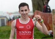 15 December 2013; Kevin Mulcaire, from Ennis Track Club, Co. Clare, celebrates with his medal after winning the Boys under-17 5000m at the Woodie’s DIY National Novice & Even Age Cross Country Championships. WIT Sports Campus, Carriganore, Co. Waterford. Picture credit: Matt Browne / SPORTSFILE
