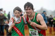 15 December 2013; Westport Athletic Club, Co. Mayo, clubmates Malcolm MacEvilly, left, and Con Doherty celebrate with their medals after winning the Boys under-11 1500m and Under-19 6000m respectively. Woodie’s DIY National Novice & Even Age Cross Country Championships, WIT Sports Campus, Carriganore, Co. Waterford. Picture credit: Matt Browne / SPORTSFILE