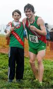 15 December 2013; Westport Athletic Club, Co. Mayo, clubmates Malcolm MacEvilly, left, and Con Doherty celebrate with their medals after winning the Boys under-11 1500m and Under-19 6000m respectively. Woodie’s DIY National Novice & Even Age Cross Country Championships, WIT Sports Campus, Carriganore, Co. Waterford. Picture credit: Matt Browne / SPORTSFILE