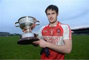 15 December 2013; Derry captain Chrissy McKaigue with the O'Fiach Cup after the game. O'Fiach Cup Final, Armagh v Derry, Crossmaglen, Co. Armagh. Photo by Sportsfile