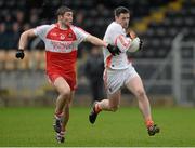 15 December 2013; Mark Lynch, Derry, in action against Robbie Tasker, Armagh. O'Fiach Cup Final, Armagh v Derry, Crossmaglen, Co. Armagh. Photo by Sportsfile