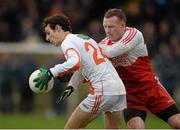 15 December 2013; Jamie Clarke, Armagh, in action against Fergal Doherty, Derry. O'Fiach Cup Final, Armagh v Derry, Crossmaglen, Co. Armagh. Photo by Sportsfile