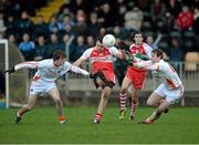 15 December 2013; Cailean O'Boyle, Derry, in action against Caolan Rafferty, left, and Kieran Toner, Armagh. O'Fiach Cup Final, Armagh v Derry, Crossmaglen, Co. Armagh. Photo by Sportsfile