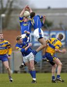 12 March 2005; Bernard McElvaney, Longford, wins possession ahead of his colleagues Trevor Glendenning, 11, and Paddy Dowd and Clare's John Moody. Allianz National Football League, Division 2A, Clare v Longford, Cusack Park, Ennis, Co. Clare. Picture credit; Ray McManus / SPORTSFILE