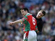 17 March 2005; Philip Larkin, James Stephens, is booked by referee Saemus Roche. AIB All-Ireland Club Senior Hurling Championship Final, Athenry v James Stephens, Croke Park, Dublin. Picture credit; Ray McManus / SPORTSFILE