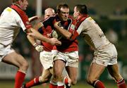 18 March 2005; John Kelly, Munster, is tackled by Gary Longwell, left, and Neil Best, Ulster. Celtic League 2004-2005, Pool 1, Munster v Ulster, Musgrave Park, Cork. Picture credit; Matt Browne / SPORTSFILE
