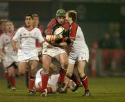 18 March 2005; Alan Quinlan, Munster, is tackled by Scott Young, Ulster. Celtic League 2004-2005, Pool 1, Munster v Ulster, Musgrave Park, Cork. Picture credit; Matt Browne / SPORTSFILE