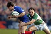 12 March 2005; Cedric Heymans, France, is tackled by Girvan Dempsey, Ireland. RBS Six Nations Championship 2005, Ireland v France, Lansdowne Road, Dublin. Picture credit; Damien Eagers / SPORTSFILE