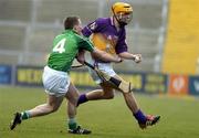 20 March 2005; Eoin Quigley, Wexford, in action against Mark Foley, Limerick. Allianz National Hurling League, Division 1B, Wexford v Limerick, Wexford Park, Wexford. Picture credit; Matt Browne / SPORTSFILE