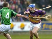 20 March 2005; Michael Jordan, Wexford, in action against Mark Foley, Limerick. Allianz National Hurling League, Division 1B, Wexford v Limerick, Wexford Park, Wexford. Picture credit; Matt Browne / SPORTSFILE