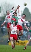 20 March 2005;James Nallen, Mayo, in action against Sean Cavanagh, left and Ryan Mellon, right, Tyrone. Allianz National Football League, Division 1A, Tyrone v Mayo, Healy Park, Omagh, Co. Tyrone. Picture credit; Oliver McVeigh / SPORTSFILE