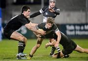 18 December 2013: Niall Delahunt, Newbridge College, in action against Tim Foley, left, and Tim Carroll, Cistercian College Roscrea. Leinster Senior League Section B Final, Cistercian College Roscrea v Newbridge College, Donnybrook Stadium, Donnybrook, Dublin. Picture credit: Ray Lohan / SPORTSFILE