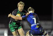 21 December 2013; Fionn Carr, Connacht, is tackled by Nicholas Cudd, Newport Gwent Dragons. Celtic League 2013/14, Round 10, Connacht v Newport Gwent Dragons, Sportsground, Galway. Picture credit: Ray Ryan / SPORTSFILE