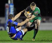 21 December 2013; Eoin Griffin, Connacht, is tackled by Jason Tovey, Newport Gwent Dragons. Celtic League 2013/14, Round 10, Connacht v Newport Gwent Dragons, Sportsground, Galway. Picture credit: Ray Ryan / SPORTSFILE