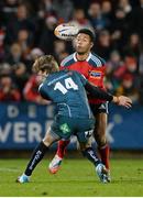 21 December 2013; Casey Laulala, Munster, is tackled by Liam Williams, Scarlets. Celtic League 2013/14, Round 10, Munster v Scarlets, Musgrave Park, Cork. Picture credit: Diarmuid Greene / SPORTSFILE