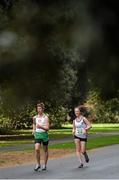 22 December 2013; Nathan Murphy, St.Coca's A.C., Co. Antrim, left, and Orla Dalahunt, Sligo A.C., competing in the Woodie’s DIY 30K Race Walking Championships of Ireland. St Anne's Park, Dublin. Picture credit: Ramsey Cardy / SPORTSFILE