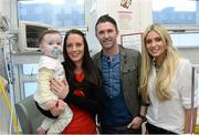 23 December 2013; Republic of Ireland international Robbie Keane and his wife Claudine, with 14 month old Ava Finn, from Tubbercurry, Co. Sligo, and her mother Aoife with during a visit to Temple Street Children's University Hospital, Temple Street, Dublin. Picture credit: David Maher / SPORTSFILE