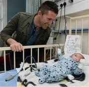 23 December 2013; Republic of Ireland international Robbie Keane with, 7 week old, Lennon Yates, from Tallaght, Co.Dublin, during a visit to Temple Street Children's University Hospital, Temple Street, Dublin. Picture credit: David Maher / SPORTSFILE