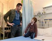 23 December 2013; Republic of Ireland international Robbie Keane with, 10 year old, James Galvin, from Raheny, Co.Dublin, during a visit to Temple Street Children's University Hospital, Temple Street, Dublin. Picture credit: David Maher / SPORTSFILE