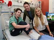 23 December 2013; Republic of Ireland international Robbie Keane and his wife Claudine,  with 15 year old Niall O'Grady, from Raheny, Co.Dublin, during a visit to Temple Street Children's University Hospital, Temple Street, Dublin. Picture credit: David Maher / SPORTSFILE