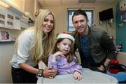 23 December 2013; Republic of Ireland international Robbie Keane and his wife Claudine with, 5 year old, Amber O'Rourke, from Carlow town, Co.Carlow, during a visit to Temple Street Children's University Hospital, Temple Street, Dublin. Picture credit: David Maher / SPORTSFILE