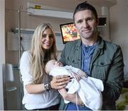 23 December 2013; Republic of Ireland international Robbie Keane and his wife Claudine holding, 2 month old, Alex Tormay, from Dunshaughlin, Co. Meath during a visit to Temple Street Children's University Hospital, Temple Street, Dublin. Picture credit: David Maher / SPORTSFILE