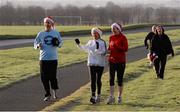 25 December 2013; Martin Stuart, Mary Kelly and Ellen Stuart, from Navan Road, Dublin, in action during the Goal Mile Christmas Day 2013. Papal Cross, Phoenix Park, Dublin. Picture credit: Ray McManus / SPORTSFILE