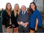 26 December 2013; Uachtarán na hÉireann Michael D. Higgins with, from left, Maebh McNulty, from Dundrum, Dublin, Miriam Kenny, from Dun Laoghaire, Dublin, and Sinead Goldrick, from Cabinteely, Dublin, during the days races. Leopardstown Christmas Racing Festival 2013, Leopardstown Racetrack, Leopardstown, Co. Dublin. Picture credit: Ray McManus / SPORTSFILE