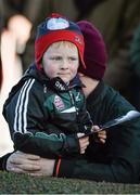 26 December 2013; Thomas Walsh, age 4, from Naas, Co. Kildare, watches the runners in the parade ring with his father Joe during a day at the races. Leopardstown Christmas Racing Festival 2013, Leopardstown Racetrack, Leopardstown, Co. Dublin. Picture credit: Barry Cregg / SPORTSFILE