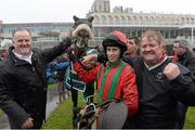 27 December 2013; Niall Reilly, left, and Aidan Shields, right, celebrate with jockey Bryan Cooper after their horse Benefficient won the Paddy Power Dial-a-Bet Steeplechase. Leopardstown Christmas Racing Festival 2013, Leopardstown Racetrack, Leopardstown, Co. Dublin. Picture credit: Matt Browne / SPORTSFILE