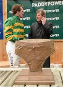 27 December 2013; Owner JP McManus and jockey Tony McCoy wait to pick up their trophies after winning the Paddy Power iPad App 3-Y-O Maiden Hurdle. Leopardstown Christmas Racing Festival 2013, Leopardstown Racetrack, Leopardstown, Co. Dublin. Picture credit: Matt Browne / SPORTSFILE