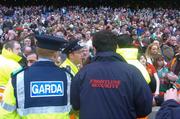 17 March 2005; Gardai and security staff prevent supporters from entering the pitch. AIB All-Ireland Club Senior Football Championship Final, Portlaoise v Ballina Stephenites, Croke Park, Dublin. Picture credit; Damien Eagers / SPORTSFILE