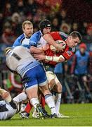 27 December 2013; James Coughlan, Munster, is tackled by Brett Wilkinson, left and Andrew Browne, Connacht. Celtic League 2013/14, Round 11, Munster v Connacht, Thomond Park, Limerick. Picture credit: Diarmuid Greene / SPORTSFILE