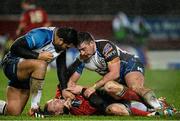 27 December 2013; Keith Earls, Munster, is held on the ground off the ball by Rodney Ah You, left, and Denis Buckley, Connacht. Celtic League 2013/14, Round 11, Munster v Connacht, Thomond Park, Limerick. Picture credit: Diarmuid Greene / SPORTSFILE