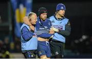 28 December 2013; Leinster's Sean O'Brien is helped from the pitch by Dr. Arthur Tanner, team doctor, left, and Karl Denvir, team physiotherapist, right, after picking up an injury in the second half. Celtic League 2013/14, Round 11. Leinster v Ulster, RDS, Ballsbridge, Dublin. Picture credit: Stephen McCarthy / SPORTSFILE