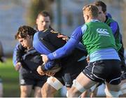 30 December 2013; Leinster's Mike McCarthy is tackled by team-mates Jamie Heaslip and Devin Toner, partially hidden, during Leinster Rugby Squad Training, UCD, Belfield, Dublin. Picture credit: Pat Murphy / SPORTSFILE