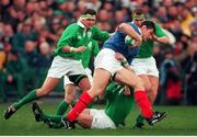 6 February 1999; Fabien Pelous, France, is tackled by Ireland's Justin Bishop, with Jeremy Davidson, right, and Dion O'Cuinneagain, left. Five Nations Rugby Championship, Ireland v France, Lansdowne Road, Dublin. Picture credit: Brendan Moran / SPORTSFILE