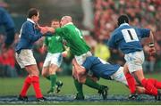 6 February 1999; Keith Wood, Ireland, is tackled by France's Fabien Pelous, Richard Dourthe, left, and Christian Califano, right.  Five Nations Rugby Championship, Ireland v France, Lansdowne Road, Dublin. Picture credit: Brendan Moran / SPORTSFILE