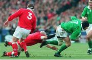 20 February 1999; Andy Ward, Ireland, escapes the tackle of Craig Quinnell and David Young (3), Wales. Five Nations Rugby International, Ireland v Wales, Wembley Stadium, London, England. Picture credit: Matt Browne / SPORTSFILE