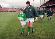 6 March 1999; 12 year old Alastair Hall a victim of the Omagh bombing is lead out by Ireland Captain Paddy Johns. Five Nations Rugby Championship, Ireland v England, Lansdowne Road, Dublin. Picture credit: Brendan Moran / SPORTSFILE