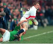 6 March 1999; Matt Perry, England, attempts to get the ball away as Justin Bishop, Ireland, puts in a tackle. Five Nations Rugby Championship, Ireland v England, Lansdowne Road, Dublin. Picture credit: Brendan Moran / SPORTSFILE