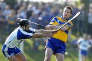 26 March 2005; Barry Nugent, Clare, has his shot blocked down by Fergal Hartley, Waterford. Allianz National Hurling League, Division 1A, Waterford v Clare, Fraher Field, Dungarvan, Co. Waterford. Picture credit; Brendan Moran / SPORTSFILE